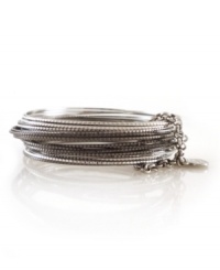 Add instant style with multiple layers. 24 bangle set by Jessica Simpson features intricate, textured bangles held together by a small chain and heart charm. Crafted in silver and hematite tone mixed metal. Approximate diameter: 2-1/2 inches. Add instant style with multiple layers. 24 bangle set by Jessica Simpson features intricate, textured bangles held together by a small chain and heart charm. Crafted in silver and hematite tone mixed metal. Approximate diameter: 2-1/2 inches.