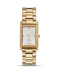 Take an uptown approach to accessorizing with this gold-plated watch from kate spade new york. It's rectangular design is city chic, while a glitzy bezel adds glamour. Take an uptown approach to accessorizing with this gold-plated watch from kate spade new york. It's rectangular design is city chic, while a glitzy bezel adds glamour.