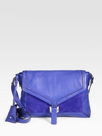 A bold and striking style in supple leather and soft suede; perfect for carrying your iPad®.Adjustable shoulder strap, 17½-20 dropBuckled flap closureOne compartment for iPad®One open pocket under flapOne inside zip pocketThree inside open pocketsFully lined14W X 9½H X 1½DImported A bold and striking style in supple leather and soft suede; perfect for carrying your iPad®.Adjustable shoulder strap, 17½-20 dropBuckled flap closureOne compartment for iPad®One open pocket under flapOne inside zip pocketThree inside open pocketsFully lined14W X 9½H X 1½DImported