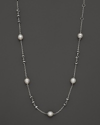 This sterling silver necklace, gleaming with freshwater pearls, makes an elegant statement. By Di MODOLO. This sterling silver necklace, gleaming with freshwater pearls, makes an elegant statement. By Di MODOLO.