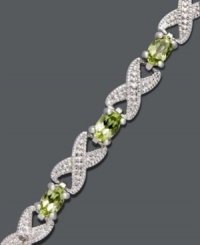 Seal it with a kiss. This exquisite bracelet by Victoria Townsend highlights glowing, oval-cut peridots (3-5/8 ct. t.w.) and diamond-accented X links. Crafted in sterling silver. Approximate length: 7 inches. Seal it with a kiss. This exquisite bracelet by Victoria Townsend highlights glowing, oval-cut peridots (3-5/8 ct. t.w.) and diamond-accented X links. Crafted in sterling silver. Approximate length: 7 inches.