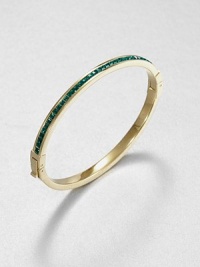 From the Cocktail Collection. Meticulously faceted, emerald-colored stones line one side of this slender bangle, in deep contrast to the other side of polished goldtone.GlassGoldtoneDiameter, about 2.5Hinged with push-lock claspImported From the Cocktail Collection. Meticulously faceted, emerald-colored stones line one side of this slender bangle, in deep contrast to the other side of polished goldtone.GlassGoldtoneDiameter, about 2.5Hinged with push-lock claspImported