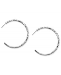 Classic cool. Nine West's J-shaped hoop earrings, crafted from silver-tone mixed metal, sparkle with glass crystal accents for a dash of elegance. Approximate diameter: 1-6/10 inches. Classic cool. Nine West's J-shaped hoop earrings, crafted from silver-tone mixed metal, sparkle with glass crystal accents for a dash of elegance. Approximate diameter: 1-6/10 inches.