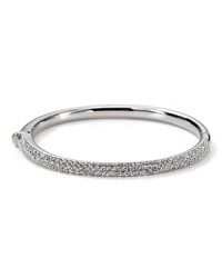 The slender bangle from Nadri is crafted in 18 Kt. gold plate with a triple-row of gleaming crystal pave to a bring a touch of light. The slender bangle from Nadri is crafted in 18 Kt. gold plate with a triple-row of gleaming crystal pave to a bring a touch of light.