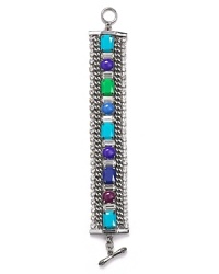 Get linked up with this chunky chain and stone bracelet from Juicy Couture, featuring colorful gems. It's pretty-punk style is sure to enliven your jewelry collection. Get linked up with this chunky chain and stone bracelet from Juicy Couture, featuring colorful gems. It's pretty-punk style is sure to enliven your jewelry collection.
