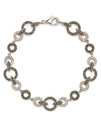Crystal stones dress up this Judith Jack bracelet and offer a glamorous complement to its striking sterling silver setting. Crystal stones dress up this Judith Jack bracelet and offer a glamorous complement to its striking sterling silver setting.