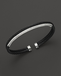18K white gold and diamonds gleam against jet black PVD on this modern nautical cable bracelet. From Charriol's Celtic Noir collection. 18K white gold and diamonds gleam against jet black PVD on this modern nautical cable bracelet. From Charriol's Celtic Noir collection.