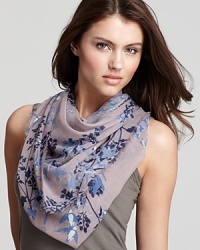 Flocks of birds and floral print decorate this elegant woven scarf from Fraas. Flocks of birds and floral print decorate this elegant woven scarf from Fraas.