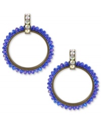 Amp up your wardrobe with a bold pop of color. Betsey Johnson's 80s-themed doorknocker earrings feature faceted blue beads and crystal accents at the post. Crafted in antiqued gold tone mixed metal. Approximate drop: 2-3/4 inches. Amp up your wardrobe with a bold pop of color. Betsey Johnson's 80s-themed doorknocker earrings feature faceted blue beads and crystal accents at the post. Crafted in antiqued gold tone mixed metal. Approximate drop: 2-3/4 inches.