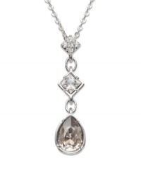 A long and elegant pendant that spells femininity all the way! Clear Swarovski crystals set in pavé gleam on the top square. Another square element sports a clear, bezel-set crystal, and a satin crystal dangles gently at the base. Crafted in silver tone mixed metal. Approximate length: 15 inches. Approximate drop: 1-3/16 inches.
