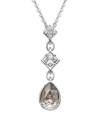 A long and elegant pendant that spells femininity all the way! Clear Swarovski crystals set in pavé gleam on the top square. Another square element sports a clear, bezel-set crystal, and a satin crystal dangles gently at the base. Crafted in silver tone mixed metal. Approximate length: 15 inches. Approximate drop: 1-3/16 inches. A long and elegant pendant that spells femininity all the way! Clear Swarovski crystals set in pavé gleam on the top square. Another square element sports a clear, bezel-set crystal, and a satin crystal dangles gently at the base. Crafted in silver tone mixed metal. Approximate length: 15 inches. Approximate drop: 1-3/16 inches.