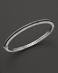 Black sapphires stud a sterling silver bangle from Judith Ripka. Black sapphires stud a sterling silver bangle from Judith Ripka.
