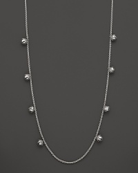 Inspired by Zen philosophy, this intricately detailed sterling silver necklace from Paul Morelli softly jingles with eight meditation bells. Inspired by Zen philosophy, this intricately detailed sterling silver necklace from Paul Morelli softly jingles with eight meditation bells.