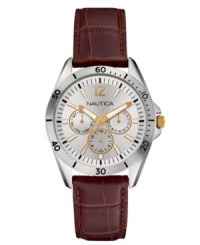 Flashes of golden tones update this brown leather watch from Nautica. Flashes of golden tones update this brown leather watch from Nautica.