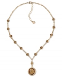 Lend a lovely look with this glittering plastic stone pendant by Carolee. Crafted in 12k gold-plated mixed metal. Approximate length: 16 inches + 2-inch extender. Approximate drop: 1-1/2 inches. Lend a lovely look with this glittering plastic stone pendant by Carolee. Crafted in 12k gold-plated mixed metal. Approximate length: 16 inches + 2-inch extender. Approximate drop: 1-1/2 inches.