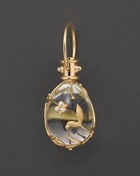 Diamond-studded, 18K yellow gold vines wrap a crystal egg. By Temple St. Clair. Diamond-studded, 18K yellow gold vines wrap a crystal egg. By Temple St. Clair.