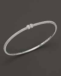 Two white sapphire hearts meet on this slim sterling silver bangle. Two white sapphire hearts meet on this slim sterling silver bangle.