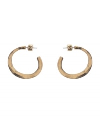 Spruce up your look with essential accessories. 3/4 style hoops by Kenneth Cole New York feature a post setting in worn gold tone mixed metal. Approximate diameter: 1 inch.