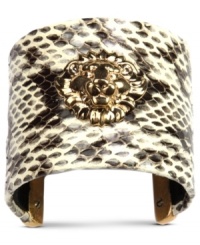 Snake charmer. Add some attitude with this sleek, python-printed cuff bracelet from Anne Klein. Embellished with the iconic lion logo, this piece truly makes a statement. Crafted from gold tone mixed metal. Approximate diameter: 2-1/2 inches. Snake charmer. Add some attitude with this sleek, python-printed cuff bracelet from Anne Klein. Embellished with the iconic lion logo, this piece truly makes a statement. Crafted from gold tone mixed metal. Approximate diameter: 2-1/2 inches.