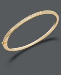 Comfortable style with a hint of sparkle. Eliot Danori's hinged bangle features glittering round-cut crystals in a gold tone mixed metal setting. Approximate diameter: 2-1/4 inches.