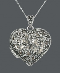 Imagine all the treasures you can keep close to your heart. This keepsake Genevieve & Grace pendant features a filigree setting that shines with the addition of glittering marcasite. Setting and chain crafted in sterling silver. Approximate length: 18 inches. Approximate drop: 1-1/4 inches. Imagine all the treasures you can keep close to your heart. This keepsake Genevieve & Grace pendant features a filigree setting that shines with the addition of glittering marcasite. Setting and chain crafted in sterling silver. Approximate length: 18 inches. Approximate drop: 1-1/4 inches.