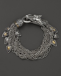 John Hardy's Naga bracelet lends fierce style with a dragon design crafted in sterling silver, accented with 18K yellow gold. John Hardy's Naga bracelet lends fierce style with a dragon design crafted in sterling silver, accented with 18K yellow gold.