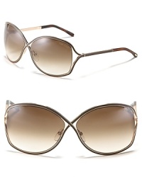 Tom Ford's chic oversized cross frames with openings at temple for a modern style. Tom Ford's chic oversized cross frames with openings at temple for a modern style.