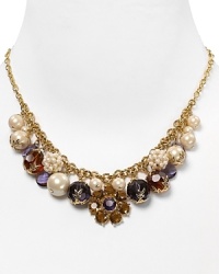 This gorgeous strand of pearls from Carolee comes accented with a bold, multi stone station, for a double dose of sophistication and colorful charm. This gorgeous strand of pearls from Carolee comes accented with a bold, multi stone station, for a double dose of sophistication and colorful charm.