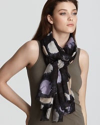 A lightweight silk scarf featuring a messy and playful polka dot print. A lightweight silk scarf featuring a messy and playful polka dot print.