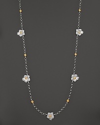 Delicate gardenias, captured at the height of their beauty in sterling silver and 18K yellow gold, bloom on this necklace from Buccellati. Delicate gardenias, captured at the height of their beauty in sterling silver and 18K yellow gold, bloom on this necklace from Buccellati.