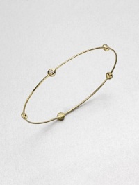 From the Regitze Gold Collection. A slender gold bangle is stationed with five bezel-set, brilliant-cut diamonds in this design of quiet dazzle.Diamonds, .20 tcw18k yellow gold Diameter, about 2½Imported From the Regitze Gold Collection. A slender gold bangle is stationed with five bezel-set, brilliant-cut diamonds in this design of quiet dazzle.Diamonds, .20 tcw18k yellow gold Diameter, about 2½Imported