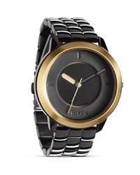 Favored for it's cool, sporty aesthetic, Nixon is the go to for watches with distinct style. This stainless steel and gunmetal piece is a prime example with a modernist design and performance level durability. Favored for it's cool, sporty aesthetic, Nixon is the go to for watches with distinct style. This stainless steel and gunmetal piece is a prime example with a modernist design and performance level durability.