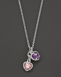 A twin heart necklace in pink crystal and amethyst framed in sterling silver. Designed by Judith Ripka. A twin heart necklace in pink crystal and amethyst framed in sterling silver. Designed by Judith Ripka.