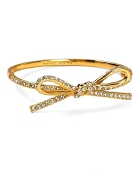 A prim and proper bow tops this kate spade new york bangle, splashed with glamorous crystal stations. A prim and proper bow tops this kate spade new york bangle, splashed with glamorous crystal stations.