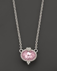 A romantic heart tops this faceted, oval-cut pendant. A romantic heart tops this faceted, oval-cut pendant.