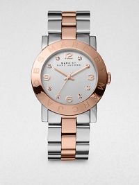 A high-contrast timepiece accented with sparkling crystals. Quartz movementWater resistant to 5 ATMRound stainless steel case, 36mm (1.4)Logo accented rose goldtone bezelSilvertone dialCrystal and numeric hour markersSecond hand Two-tone stainless steel link braceletImported A high-contrast timepiece accented with sparkling crystals. Quartz movementWater resistant to 5 ATMRound stainless steel case, 36mm (1.4)Logo accented rose goldtone bezelSilvertone dialCrystal and numeric hour markersSecond hand Two-tone stainless steel link braceletImported