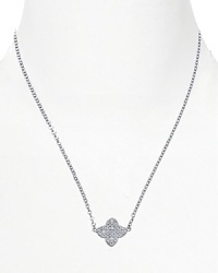 Distinctive and dazzling. This clover-shaped pendant from Crislu marries classic iconography with sparkling crystals. Distinctive and dazzling. This clover-shaped pendant from Crislu marries classic iconography with sparkling crystals.