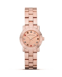 Encircled by colored, glimmering crystals, MARC BY MARC JACOBS's Mini Dexter bracelet watch lends an everyday look livened up with a hint of glamour. Encircled by colored, glimmering crystals, MARC BY MARC JACOBS's Mini Dexter bracelet watch lends an everyday look livened up with a hint of glamour.