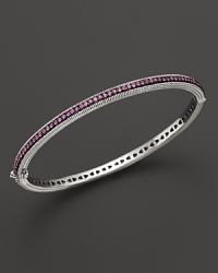 Pink sapphires stud a sterling silver bangle from Judith Ripka. Pink sapphires stud a sterling silver bangle from Judith Ripka.