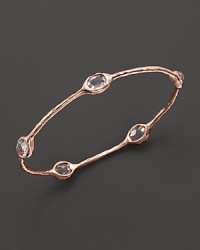 From the Rosé collection, five clear quartz stations on a hammered bangle. Designed by Ippolita. From the Rosé collection, five clear quartz stations on a hammered bangle. Designed by Ippolita.