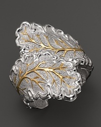 An oak leaf is detailed in 18K yellow gold accents on Buccellati's nature-inspired cuff bracelet. An oak leaf is detailed in 18K yellow gold accents on Buccellati's nature-inspired cuff bracelet.