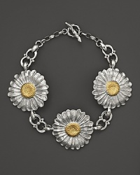 Blooming daisies make a feminine statement on Buccellati's chain bracelet. Blooming daisies make a feminine statement on Buccellati's chain bracelet.