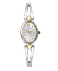 The beauty of a bangle bracelet with the Bulova precision you trust. By Caravelle. Two-tone mixed metal bangle and oval case. Silver tone sunray dial features gold tone dot markers, numerals at twelve and six o'clock, gold tone hour and minute hands, sweeping second hand and logo. Quartz movement. Water resistant to 30 meters. Two-year limited warranty. The beauty of a bangle bracelet with the Bulova precision you trust. By Caravelle. Two-tone mixed metal bangle and oval case. Silver tone sunray dial features gold tone dot markers, numerals at twelve and six o'clock, gold tone hour and minute hands, sweeping second hand and logo. Quartz movement. Water resistant to 30 meters. Two-year limited warranty.