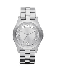 A cool logo plaque details this MARC BY MARC JACOBS watch, which is classically styled in plated metal and set on a matching bracelet. A cool logo plaque details this MARC BY MARC JACOBS watch, which is classically styled in plated metal and set on a matching bracelet.