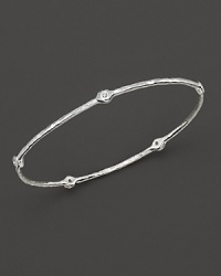 From the Silver collection, a five-diamond hammered bangle in sterling silver. Designed by Ippolita. From the Silver collection, a five-diamond hammered bangle in sterling silver. Designed by Ippolita.