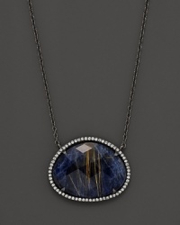 Blue sodalite pendant with quartz and diamonds on a blackened silver necklace. From Di Massima. Blue sodalite pendant with quartz and diamonds on a blackened silver necklace. From Di Massima.