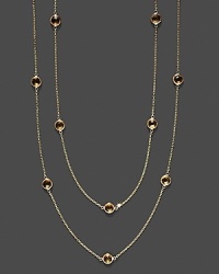 Eighteen faceted citrine stations sparkle in a long, loopable 14K yellow gold chain. Eighteen faceted citrine stations sparkle in a long, loopable 14K yellow gold chain.
