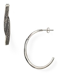 Judith Jack shapes up with this pair of sterling silver hoop earrings. Dipped in marcasite stones, this style flaunts an eye-catching design with sophisticated sparkle. Judith Jack shapes up with this pair of sterling silver hoop earrings. Dipped in marcasite stones, this style flaunts an eye-catching design with sophisticated sparkle.
