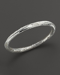 Hammered, faceted sterling silver bangle. Hammered, faceted sterling silver bangle.