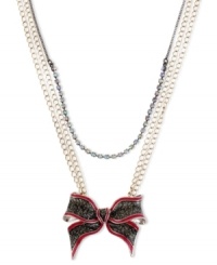 Tie something new. This shimmering bow pendant from Betsey Johnson makes a perfect present for yourself or a loved one. The necklace is crafted from gold and hematite tone mixed metal and features a crystal cup chain accent. Approximate length: 16 inches + 3-inch extender. Approximate drop: 2 inches. Tie something new. This shimmering bow pendant from Betsey Johnson makes a perfect present for yourself or a loved one. The necklace is crafted from gold and hematite tone mixed metal and features a crystal cup chain accent. Approximate length: 16 inches + 3-inch extender. Approximate drop: 2 inches.